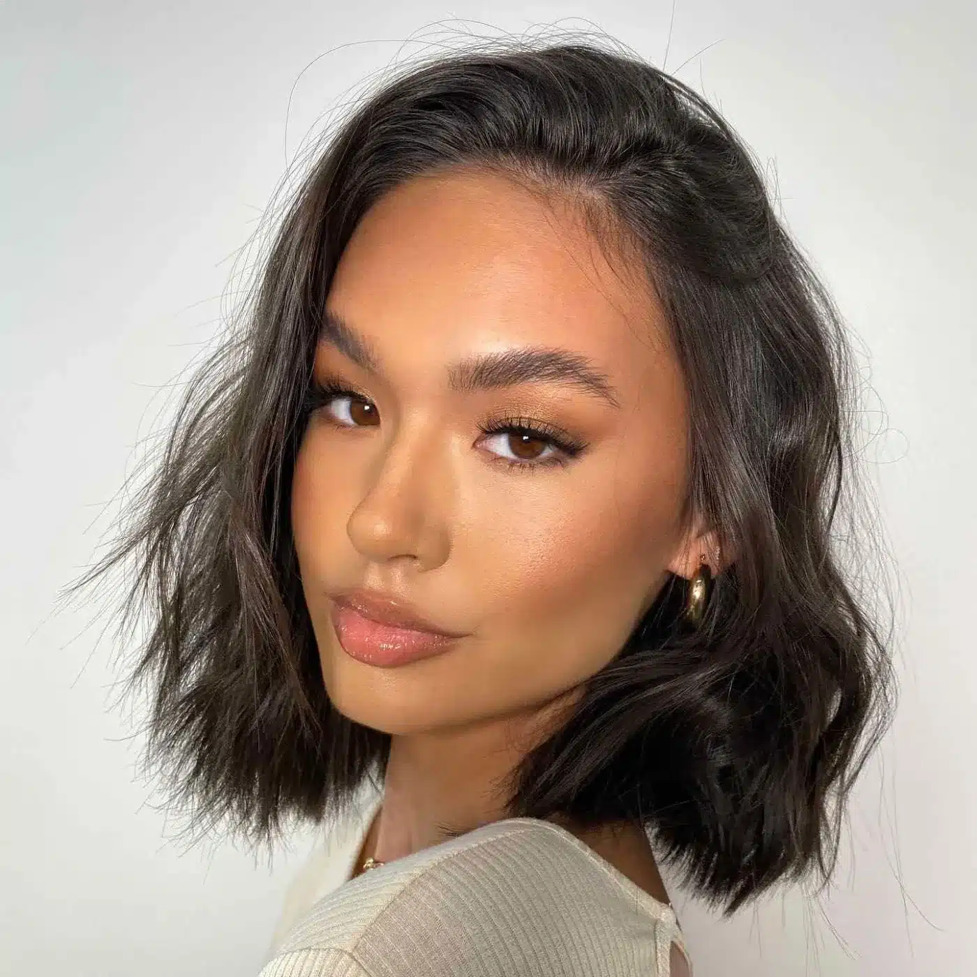 Side-Swept Shoulder Cut with graceful parting