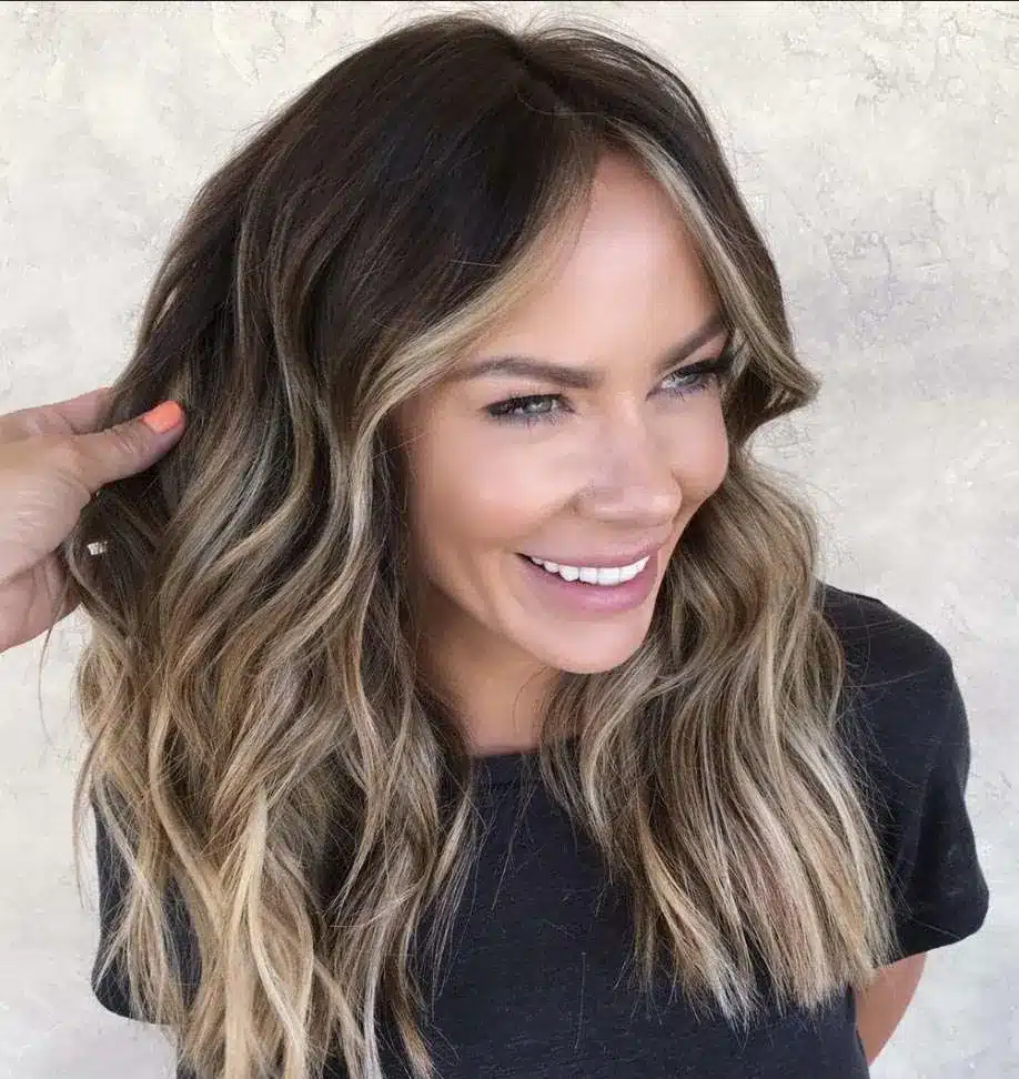 Southern Glam hairstyle with soft waves and glossy finish