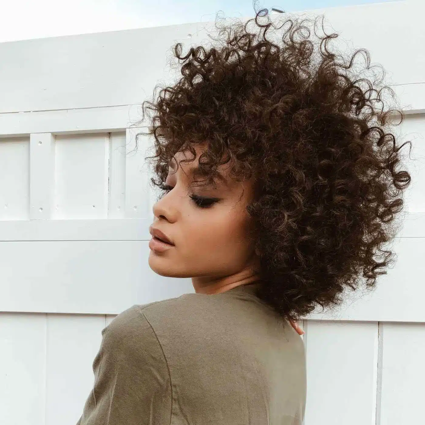 Defined Curls hairstyle with structured wave pattern
