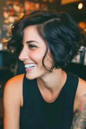Voluminous wavy bixie representing 31 Bixie Haircuts That Perfectly Blend Bob and Pixie Hairstyles