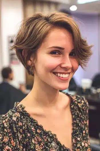Swoopy layered bixie with flipped ends illustrating 31 Bixie Haircuts That Perfectly Blend Bob and Pixie Hairstyles