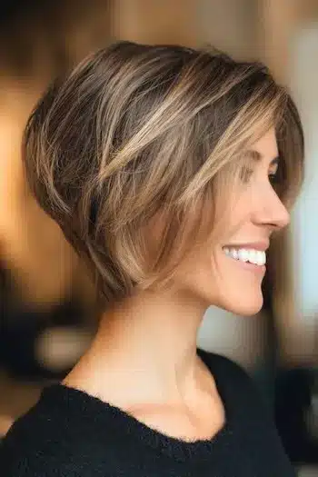 Stacked bixie with blonde balayage illustrating 31 Bixie Haircuts That Perfectly Blend Bob and Pixie Hairstyles