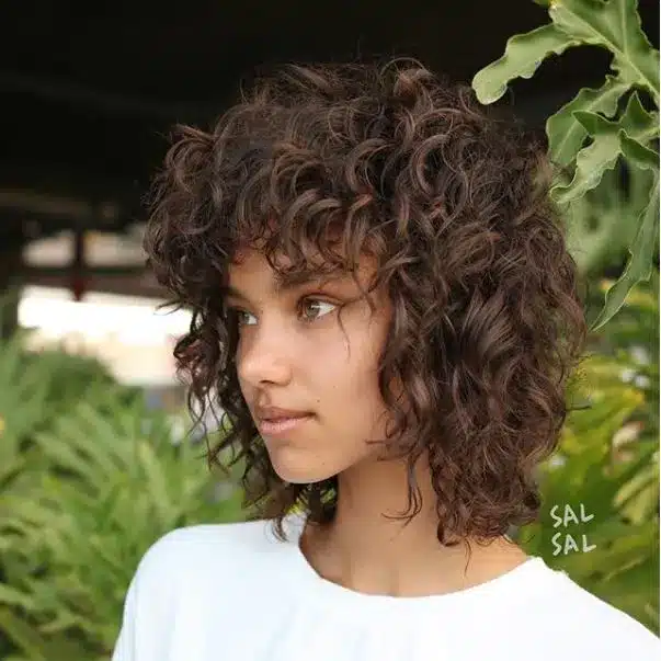 35 Short Brown Hairstyles You'll Be Seeing Everywhere 31 Curly Shag