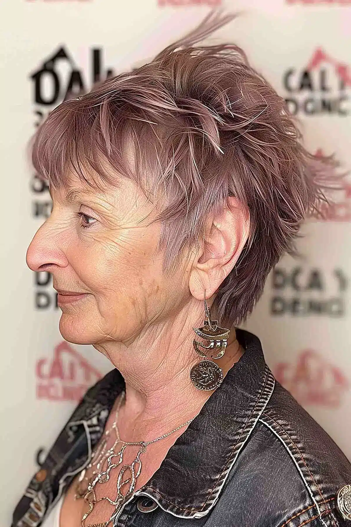 Textured shaggy haircut with natural grey-brown tones for women over 70.