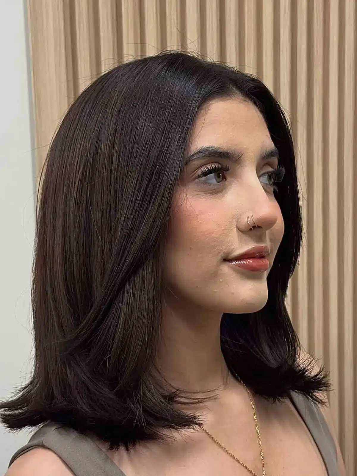 50 Low-Maintenance Medium-Length Haircuts for Busy Women 1 Center part curtain layers with feathered flip