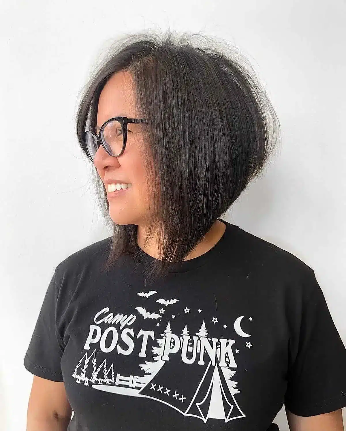50 Low-Maintenance Medium-Length Haircuts for Busy Women 33 Long Angled Bob for Older Women with Glasses