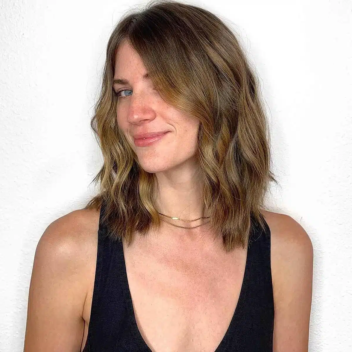 50 Low-Maintenance Medium-Length Haircuts for Busy Women 41 Razored Medium-Length Cut for Thick Hair