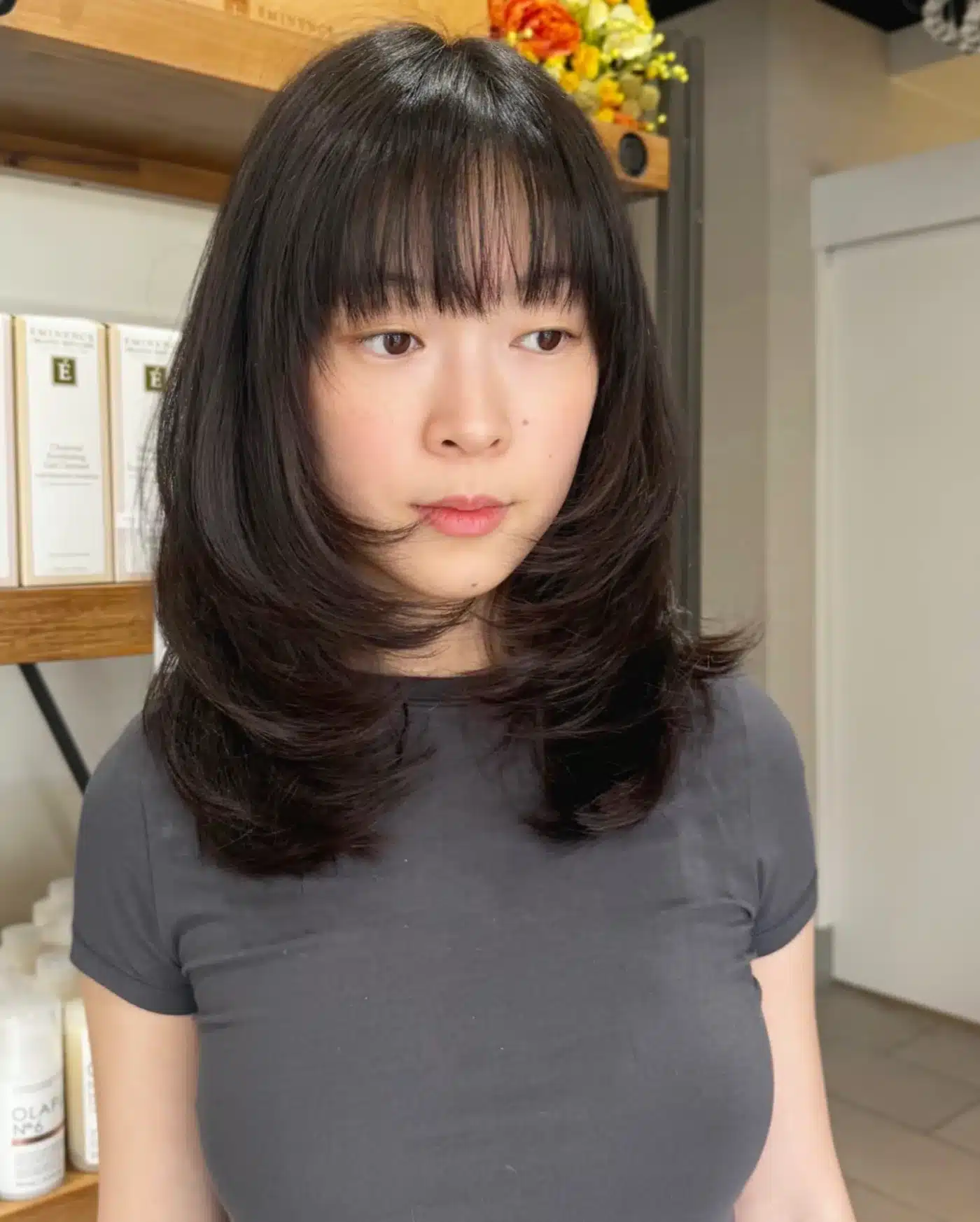 50 Low-Maintenance Medium-Length Haircuts for Busy Women 4 Collarbone-Grazing Feathered Cut with See-Through Micro Fringe