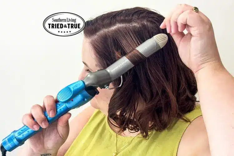 A person curling their hair using the BaByliss Pro Nano Titanium 1-inch Spring Curling Iron